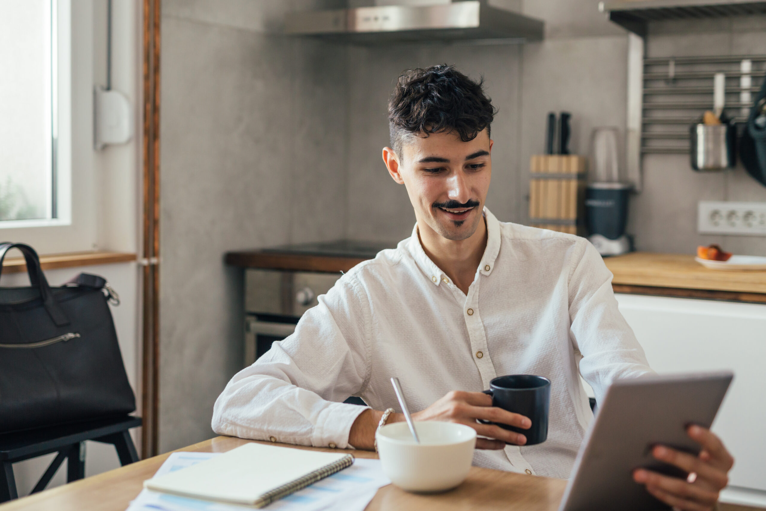 Person developing healthy daily routines with journal and morning setup